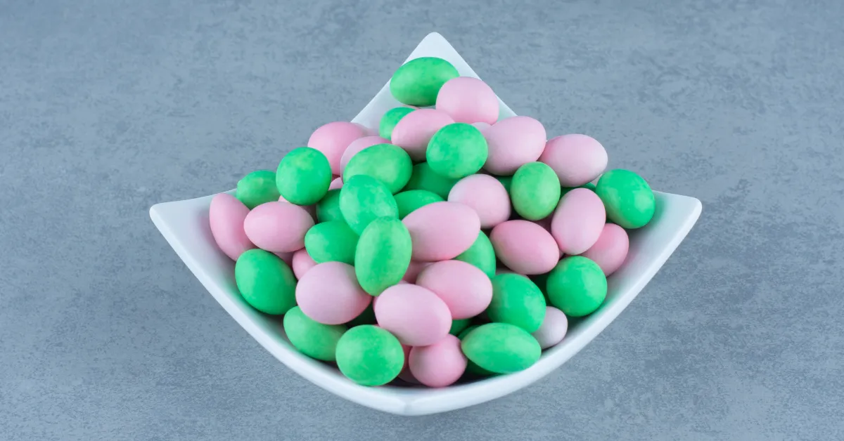 Pink and green marshmallow candies in white bowl, elf on the shelf marshmallow ideas theme setup